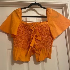 Orange Anthropologie top
